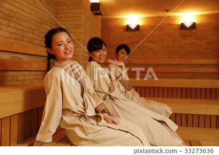 Woman entering the sauna Woman entering the sauna 33273636