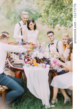 The lovely portrait of the newlyweds cutting their 33273776