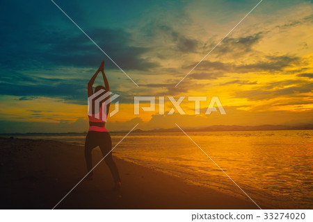 Silhouette young woman practicing yoga Silhouette young woman practicing yoga 33274020