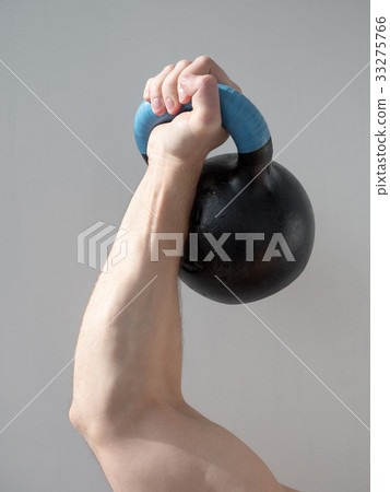 Man's hand holding dumbbell isolated Man's hand holding dumbbell isolated 33275766