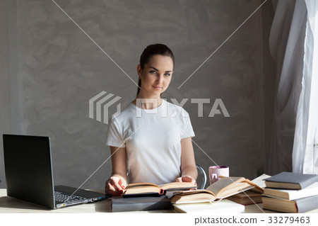 girl is preparing for the exam reading book works 33279463