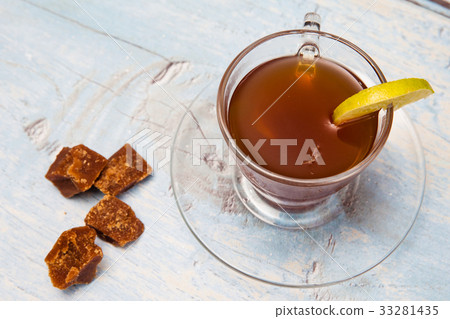 Hot sugarcane-water (aguapanela) with lemon Hot sugarcane-water (aguapanela) with lemon 33281435