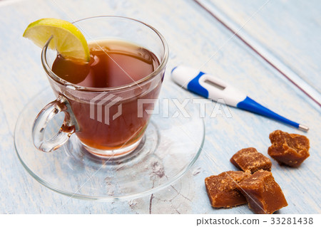 Hot sugarcane-water (aguapanela) with lemon Hot sugarcane-water (aguapanela) with lemon 33281438