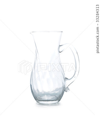 Empty glass jar on a white background. 33284313