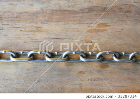 iron chain on wooden board iron chain on wooden board 33287314