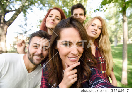 Group of friends taking selfie in urban background Group of friends taking selfie in urban background 33288647