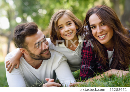 Happy young family in a urban park 33288651