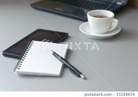 Laptop, tablet and cup of tea 33288654