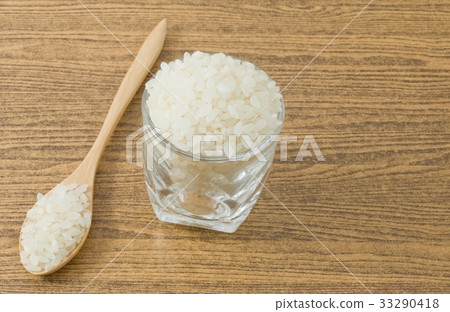 Japanese Rice in A Wooden Spoon and Glass Cup 33290418