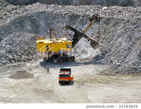 huge excavator, truck and man standing  33293629