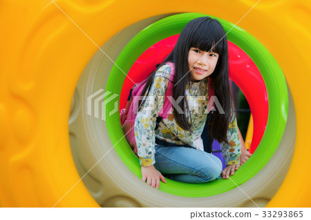 Asian kid fun and happy from play a donus ring in playgroung Asian kid fun and happy from play a donus ring in playgroung 33293865
