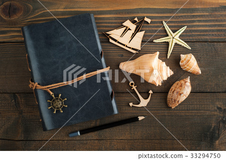 Notebook, sea shells and wooden ship Notebook, sea shells and wooden ship 33294750