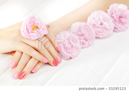 pink manicure with tea rose flowers. spa pink manicure with tea rose flowers. spa 33295123