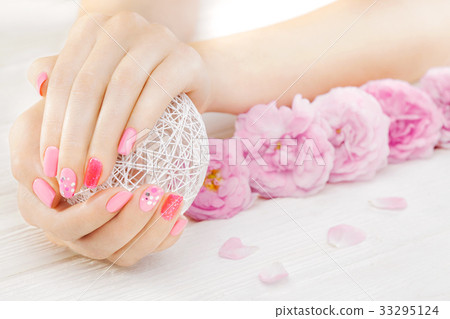 pink manicure with fresh tea rose, white ball of pink manicure with fresh tea rose, white ball of 33295124