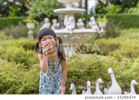 Happy girl in garden 33296474
