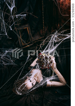 Lady in dark interior 33298988