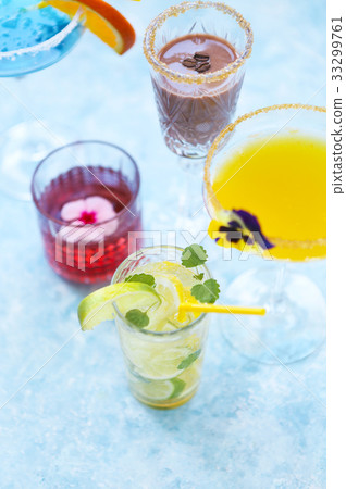 Alcohol cocktails on the turquoise background 33299761