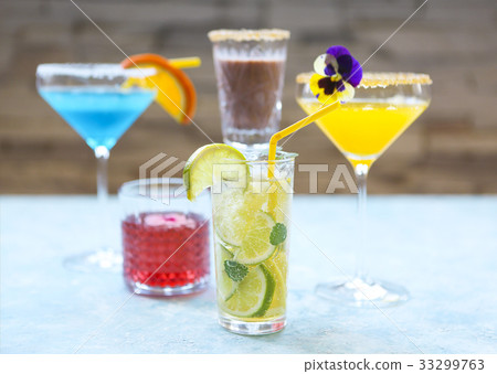 Alcohol cocktails on the turquoise background 33299763