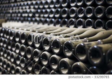 Wine or champagne bottles aged in cellar 33299765