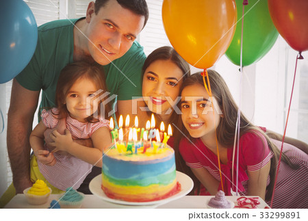 Portrait of family celebrating birthday 33299891