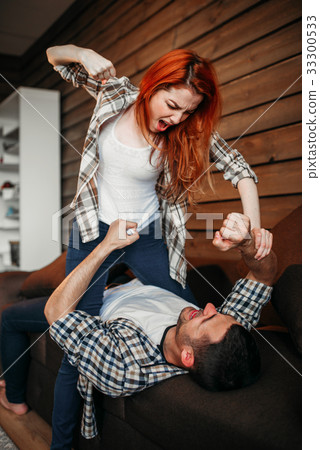Man strangles woman with a tie, domestic violence 33300533