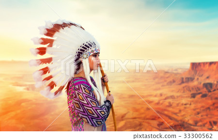 American Indian woman against mountain valley American Indian woman against mountain valley 33300562