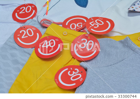 Clothes with discount labels Seasonal sale 33300744