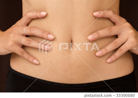 The shape of the waist of Asian girl after surgery 33300880