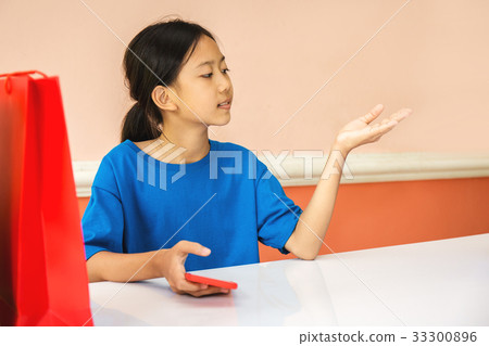 Asian girl playing colorful shopping bag 33300896