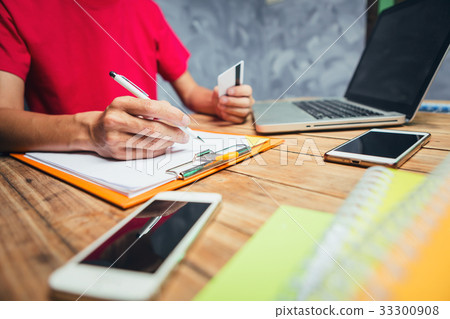 Young asian businessman working hard to check 33300908