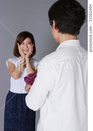 Young woman getting a present 33301404