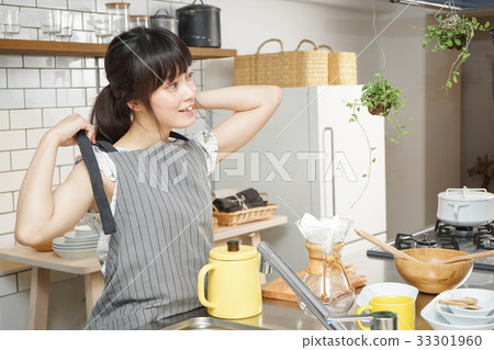 A young Japanese woman working in a cafe A young Japanese woman working in a cafe 33301960