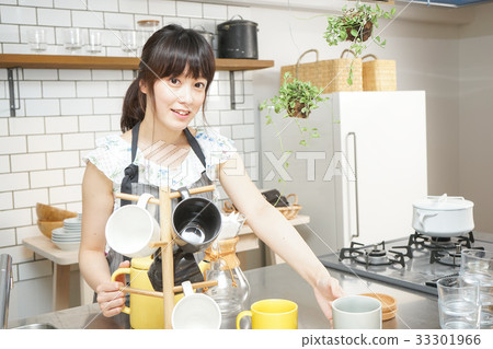 A young Japanese woman working in a cafe A young Japanese woman working in a cafe 33301966
