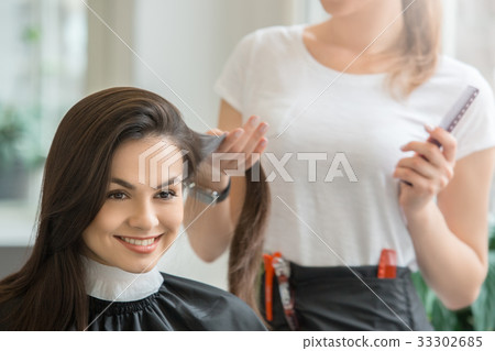 Young women sitting in beauty hair salon style 33302685
