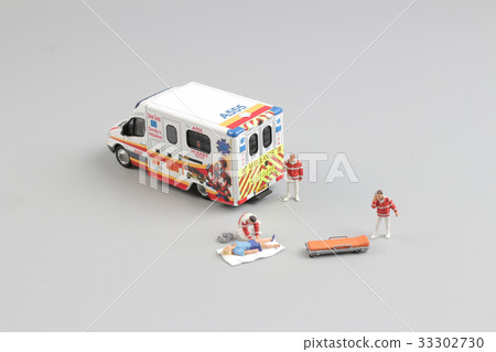paramedics transport a patient to ambulance car 33302730