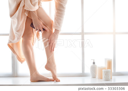 Young woman body care at home indoors Young woman body care at home indoors 33303306