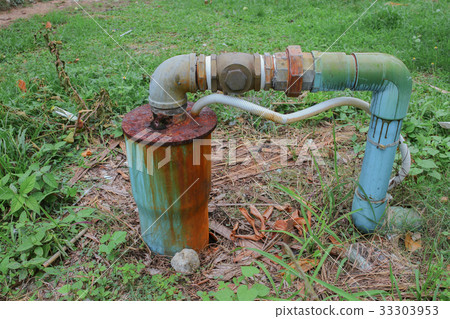 Water valve Plumbing Steel dilapidated on grass Water valve Plumbing Steel dilapidated on grass 33303953