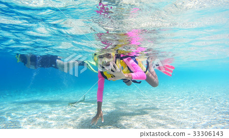 Underwater photograph of Okinawa Akajima Parents and children who do snorkeling 33306143