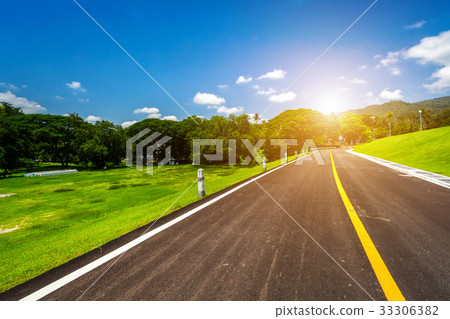 road in mountain forest sky with white clouds road in mountain forest sky with white clouds 33306382