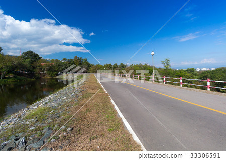 Sunlight guide road in mountain forest sky 33306591