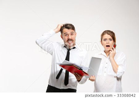 The business man and woman communicating on a gray The business man and woman communicating on a gray 33308042