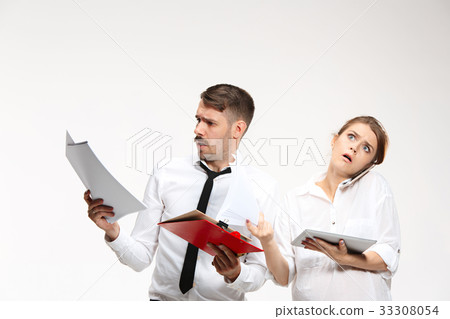 The business man and woman communicating on a gray 33308054