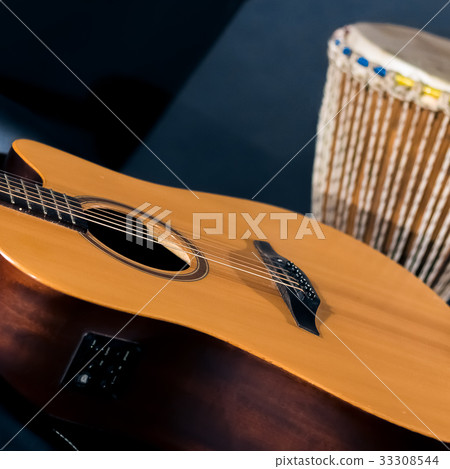 Acoustic guitar with percussion drum Acoustic guitar with percussion drum 33308544