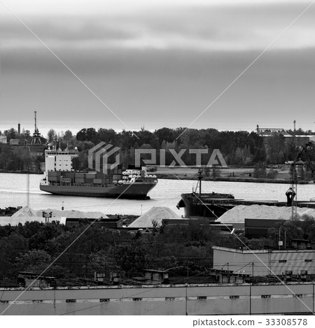 Container ship entering port of Riga 33308578