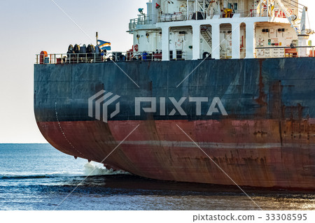 Black cargo ship's stern 33308595