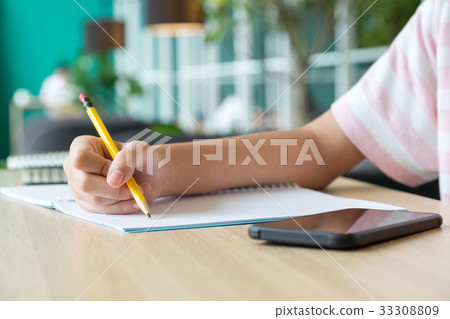 Close up hand of teenager learn online with mobile Close up hand of teenager learn online with mobile 33308809