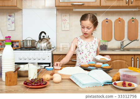 Child girl baking in home kitchen. Healthy food 33312756
