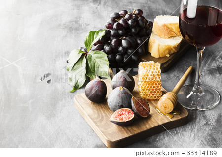 Various snack - fig, grapes, bread, honey Various snack - fig, grapes, bread, honey 33314189