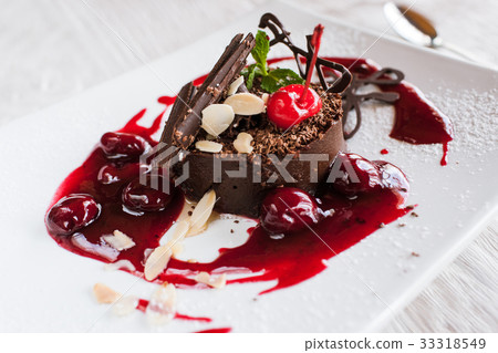 Chocolate cake on white plate with decoration 33318549