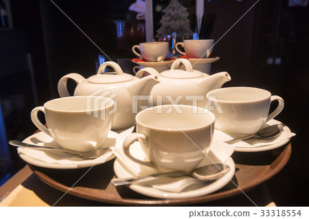 White teaset on tray in restaurant White teaset on tray in restaurant 33318554